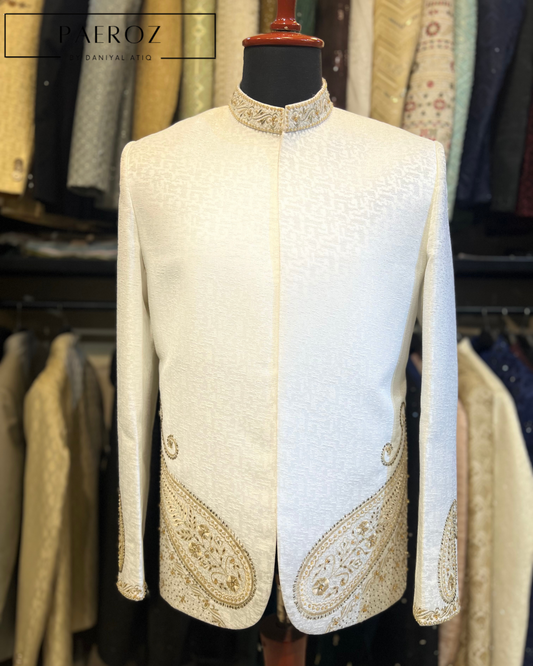 White embroidered jacket on a mannequin against a clothing store background